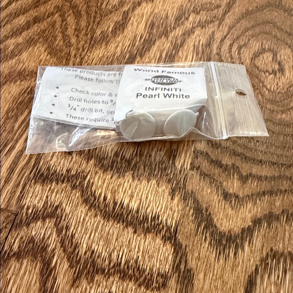 Car INFINITI Pearl White World Famous Bumper Plugs